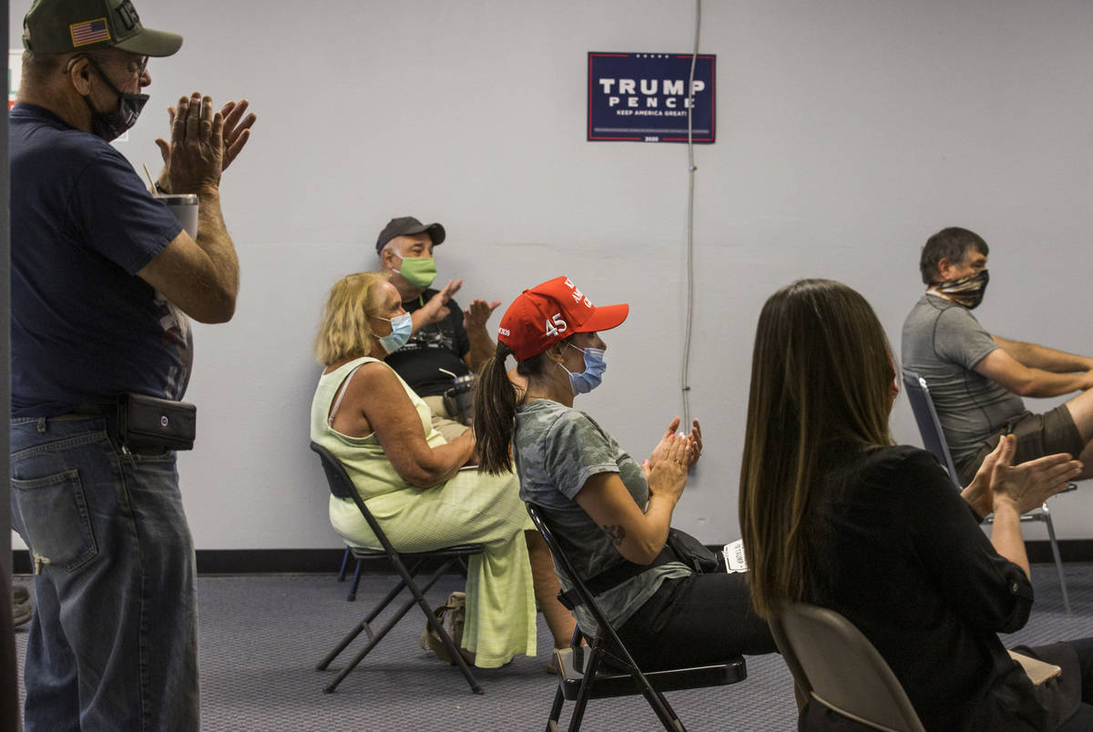 Volunteer Cassandra Hoer, center, applauds with others as they receive in-person training at Pr ...