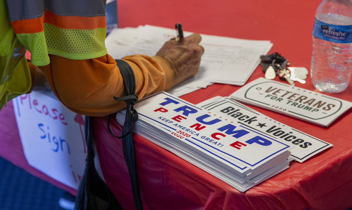 Another volunteer signs in to receive in-person training at President Donald Trump's re-electi ...