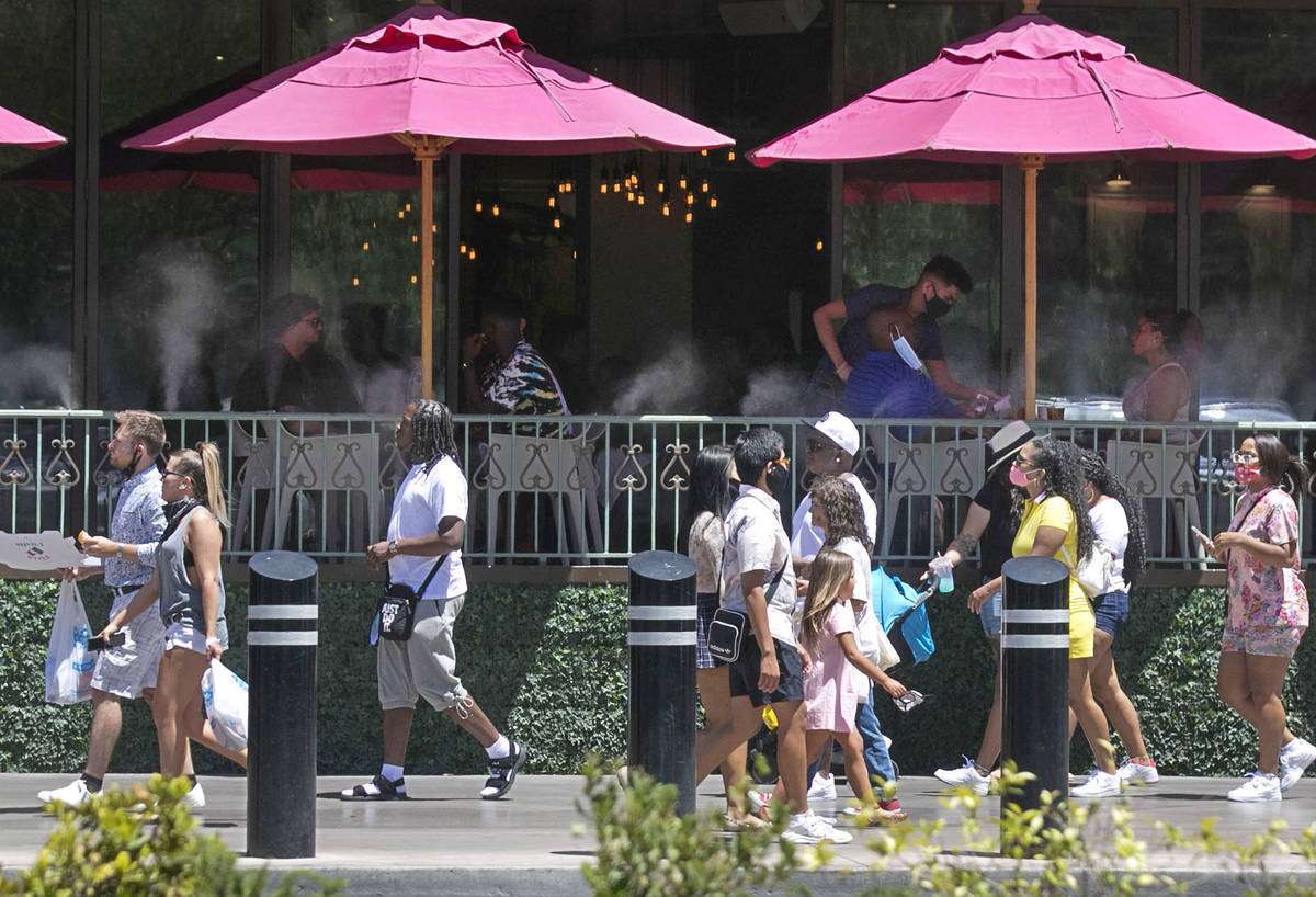 Tourists walk along Las Vegas Boulevard on Friday, July 3, 2020, in Las Vegas. (Bizuayehu Tesfa ...