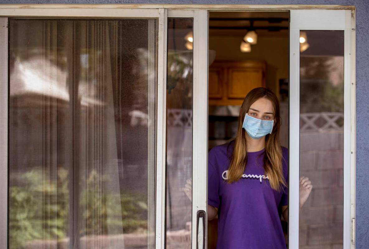 Kaydee Asher, 16, socially distanced at her back door, is currently fighting the coronavirus an ...