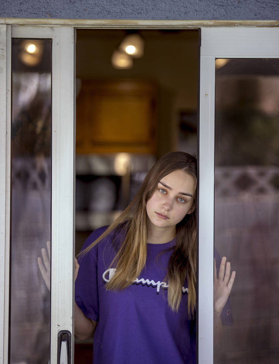 Kaydee Asher, 16, socially distanced at her back door, is currently fighting the coronavirus an ...
