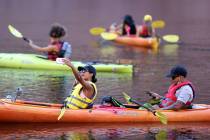 Ashia Paez and Tristan Castillo, both of New York, kayak on the Colorado River in Black Canyon ...