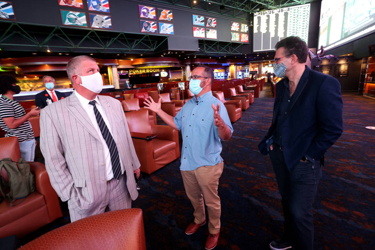 Circa Las Vegas co-owner and CEO Derek Stevens, left, chats with Westgate sportsbook vice presi ...