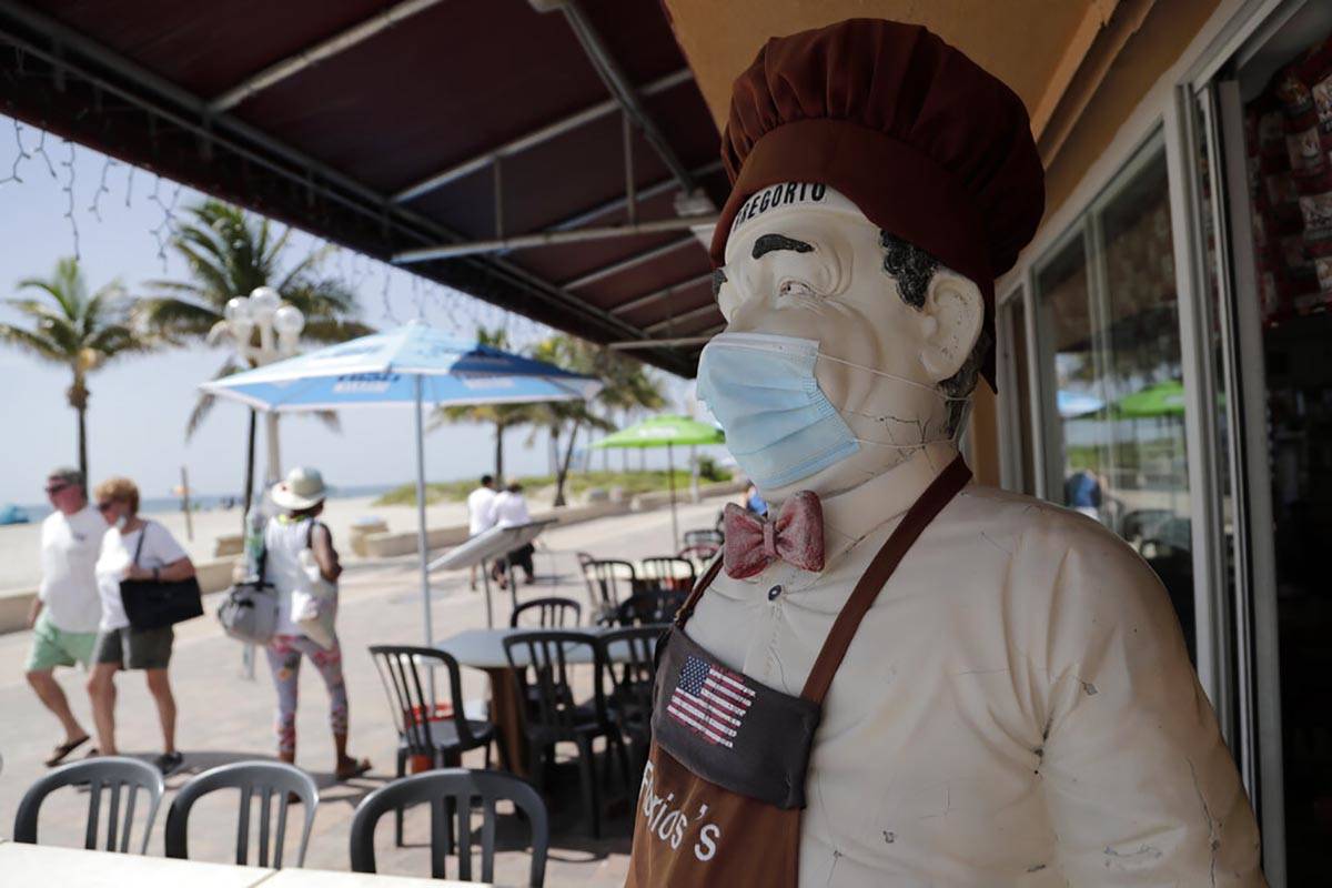 CORRECTS TO BROADWALK, INSTEAD OF BOARDWALK A statue of a chef at Florio's of Little Italy res ...