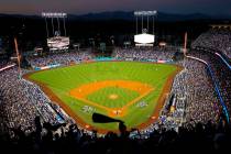 In this Oct. 25, 2017, file photo, the Houston Astros and the Los Angeles Dodgers play in Game ...