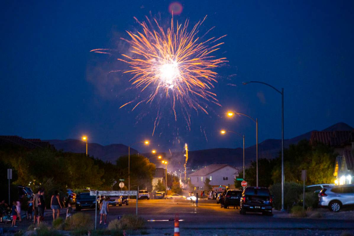 People set off fireworks along Desert Palm Drive in Las Vegas on Saturday, July 4, 2020. (Chase ...