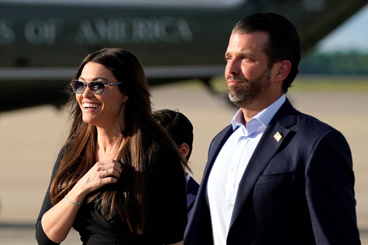 Donald Trump Jr., right, walks with his girlfriend, Kimberly Guilfoyle, after arriving at Andre ...