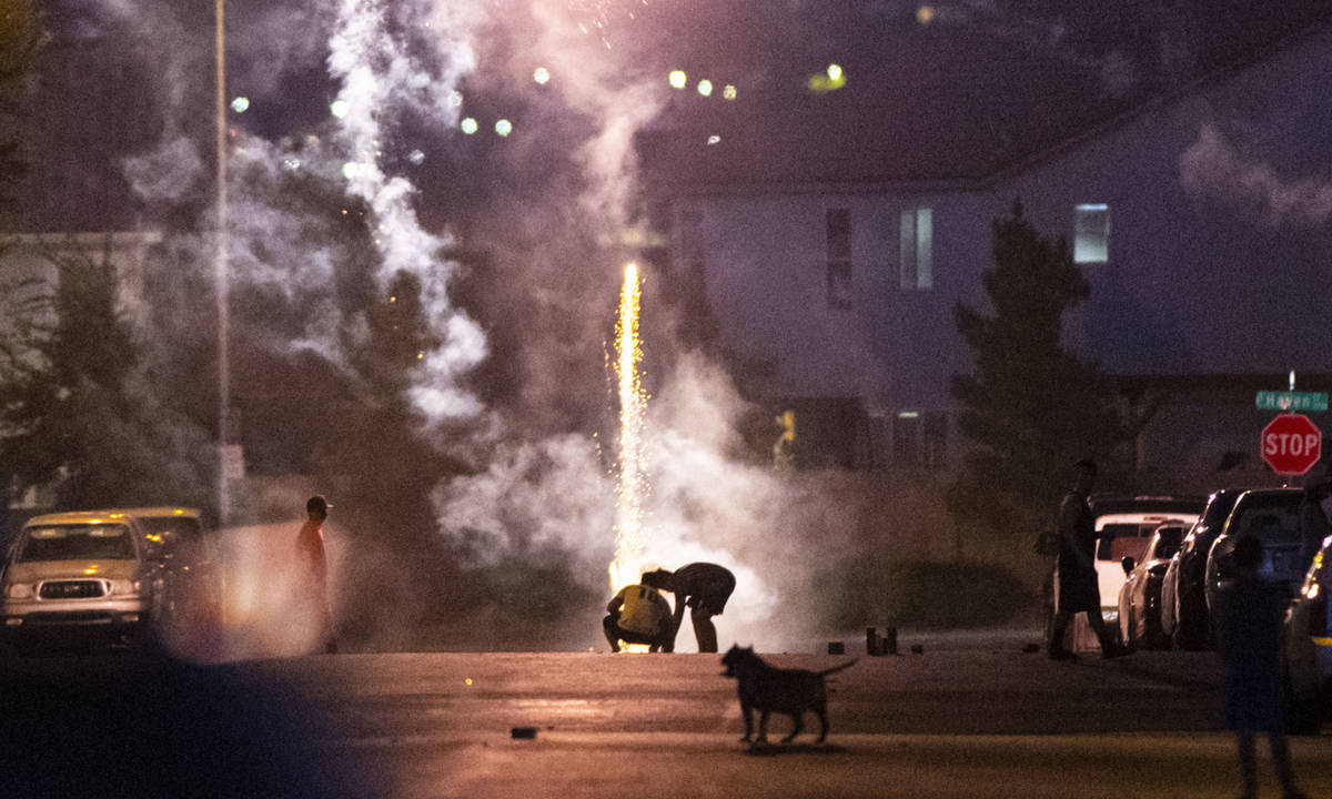 People set off fireworks along Desert Palm Drive in Las Vegas on Saturday, July 4, 2020. (Chase ...