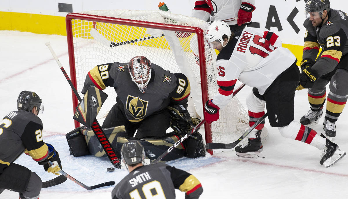 Vegas Golden Knights goaltender Robin Lehner (90) makes a save against New Jersey Devils center ...