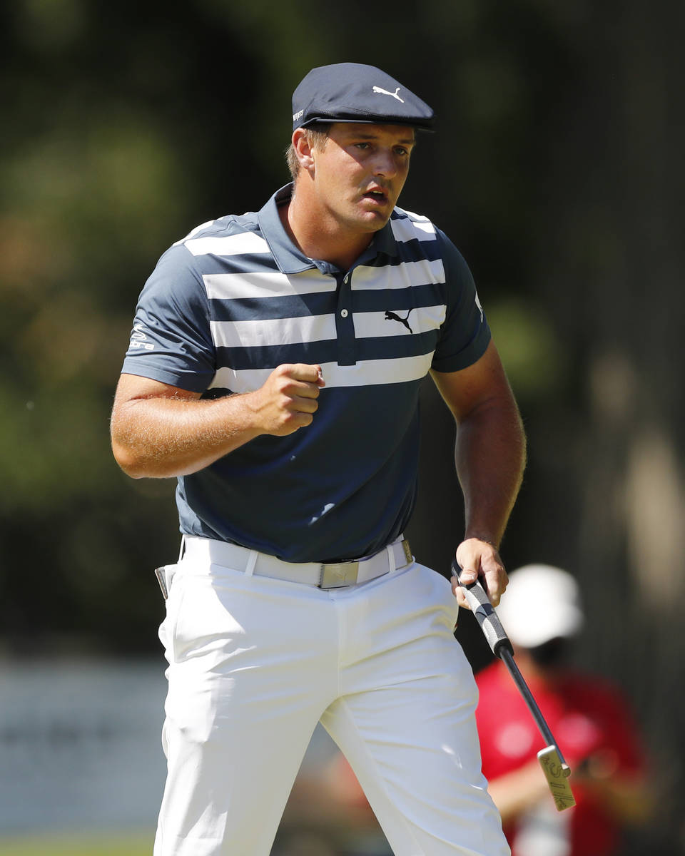 Bryson DeChambeau pumps his fist after a birdie putt on the 10th green during the final round o ...