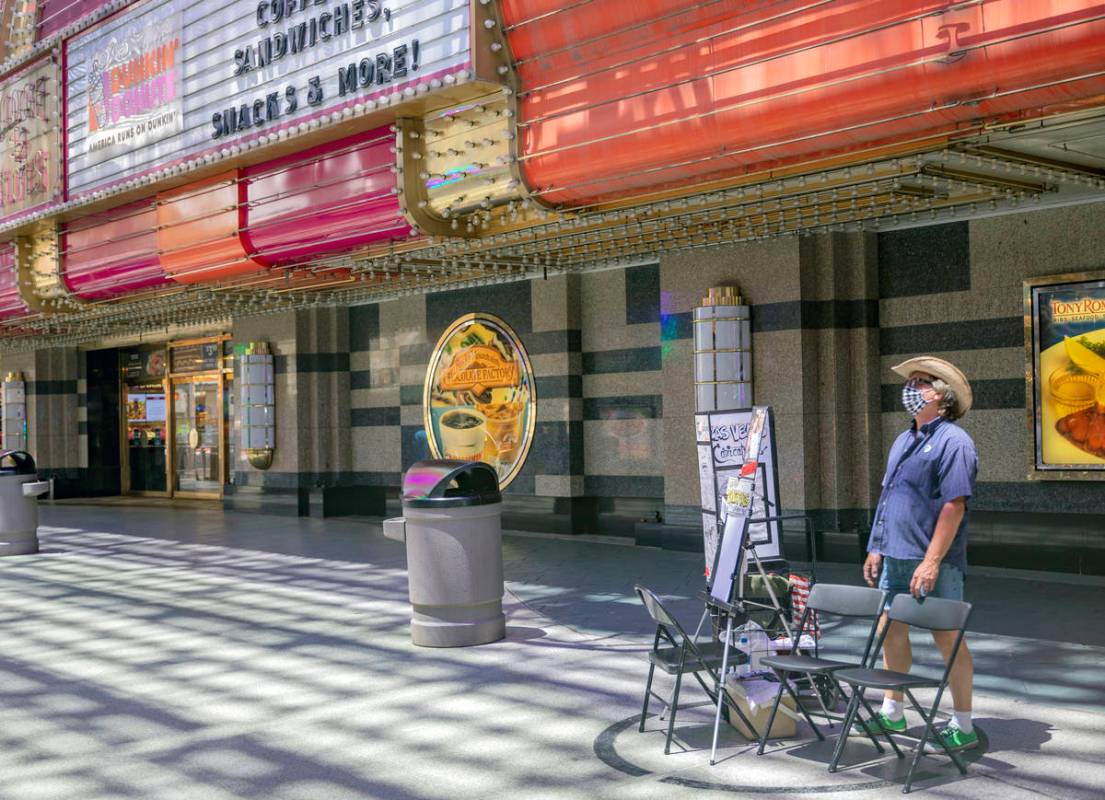 Mike Warden of Las Vegas Caricatures waits by his outdoor drawing space in the Fremont Street E ...