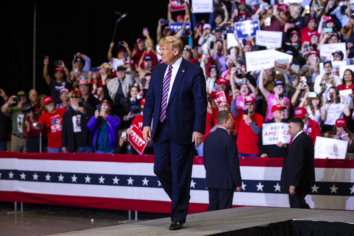 President Donald Trump arrives for a rally at the Las Vegas Convention Center in Las Vegas on F ...