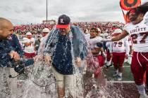 Liberty coach Rich Muraco is given a Gatorade bath after defeating Centennial 50-7 to win the C ...