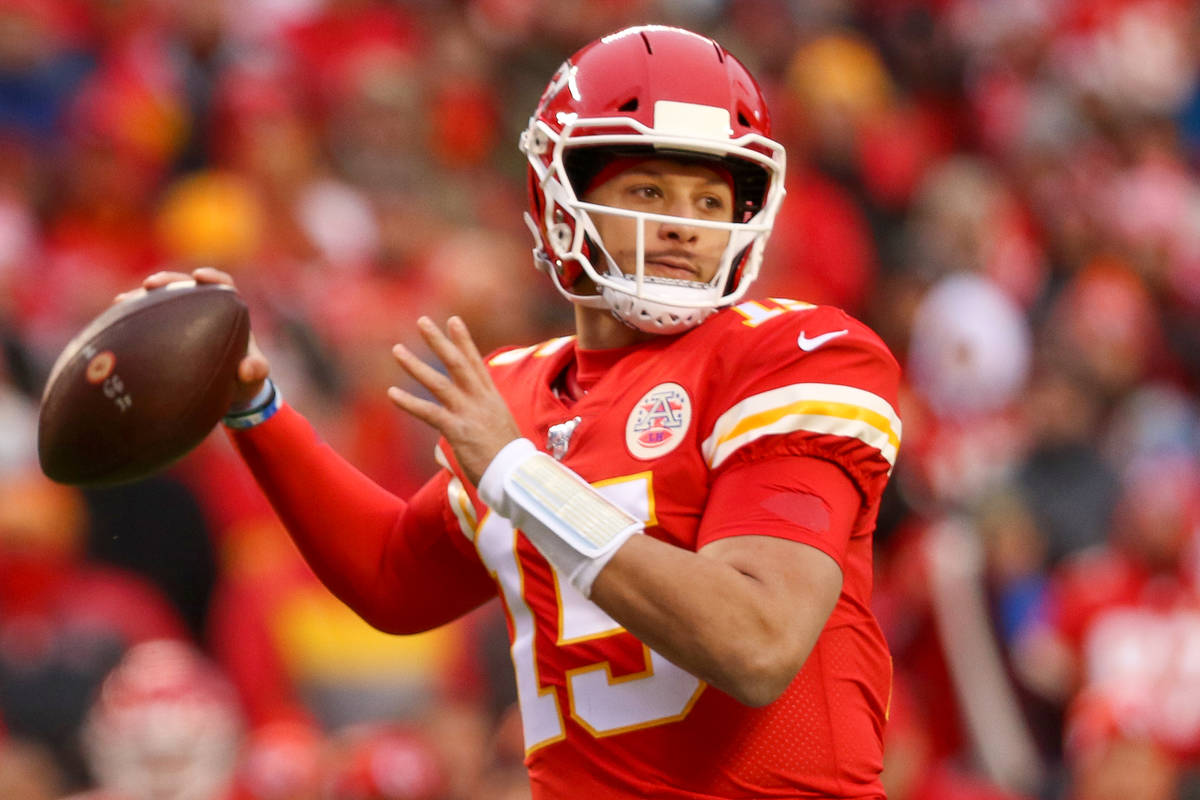 Kansas City Chiefs quarterback Patrick Mahomes (15) prepares to throw the football during the f ...