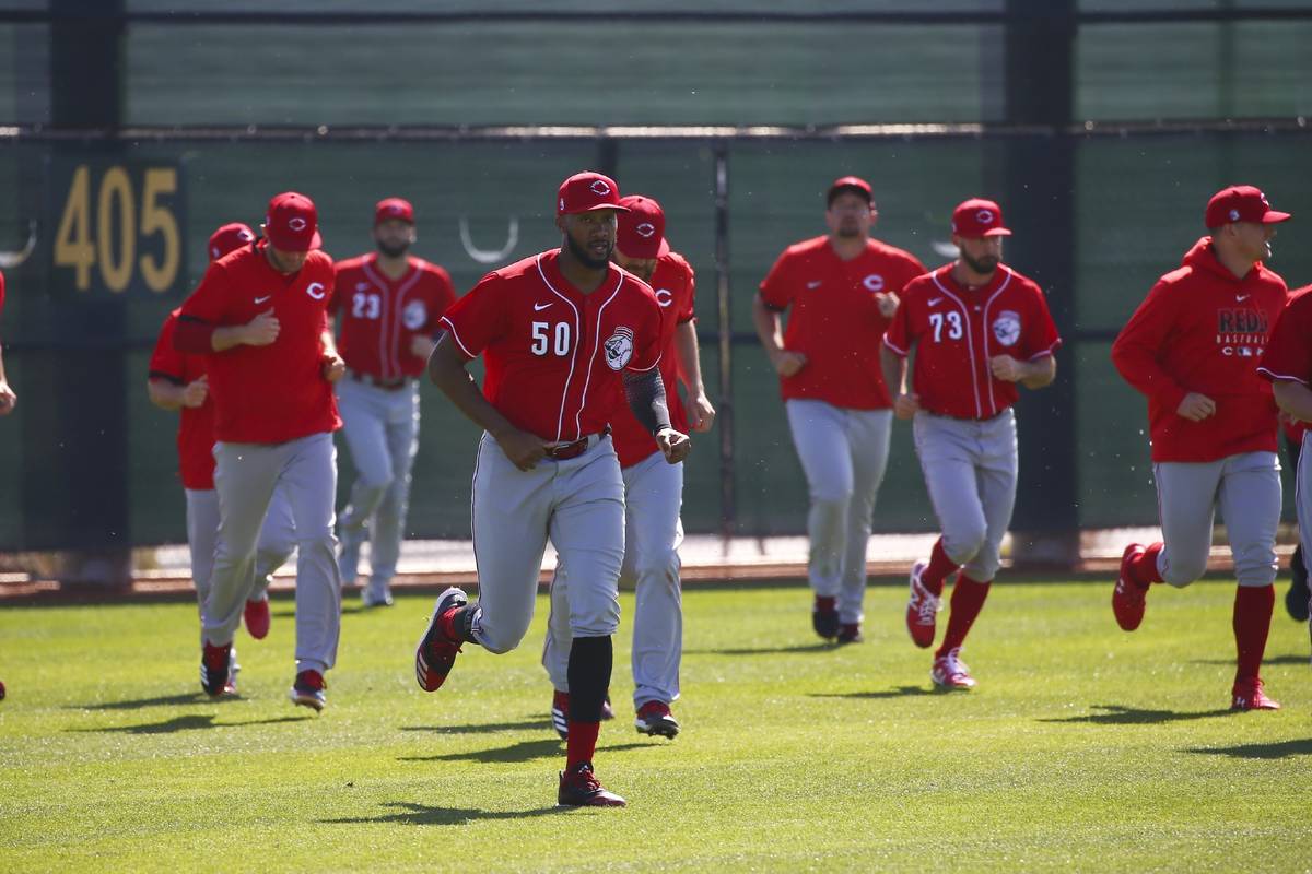 In this Feb. 17, 2020, file photo, Cincinnati Reds relief pitcher Amir Garrett leads other pitc ...
