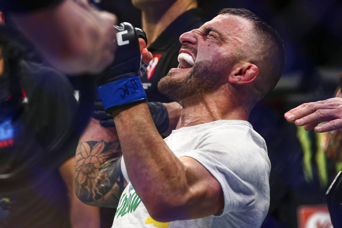 Alexander Volkanovski reacts after being declared the winner via unanimous decision over Max Ho ...