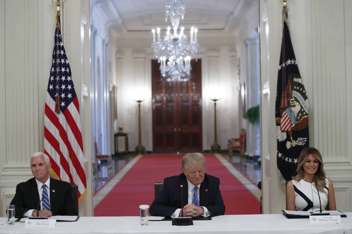 President Donald Trump, Vice President Mike Pence, left, and first lady Melania Trump, attend a ...