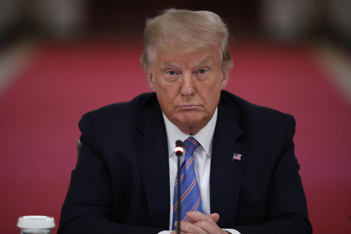 President Donald Trump listens during a "National Dialogue on Safely Reopening America's S ...