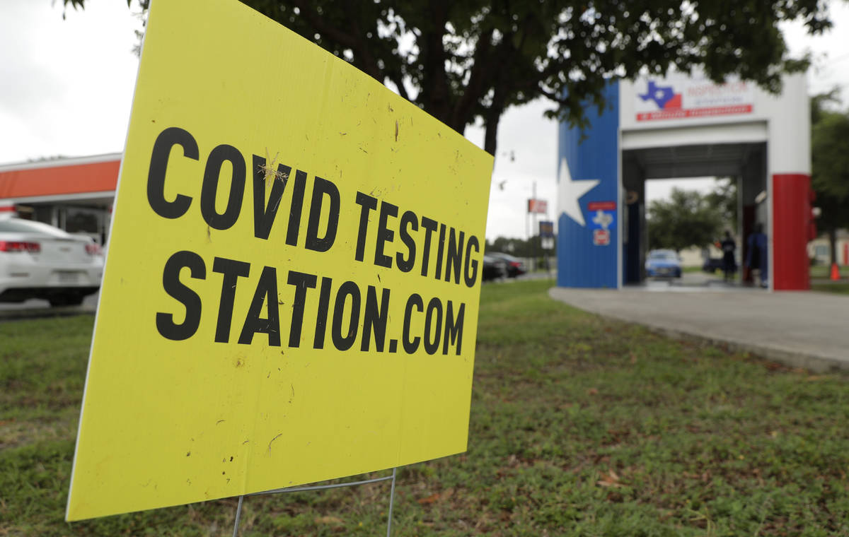 COVID-19 antibody testing and diagnostic testing are administered at a converted vehicle inspec ...