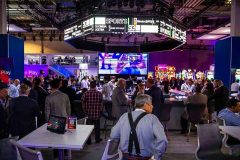 The bar is in full swing within the Scientific Games Corporation exhibition space during the Gl ...