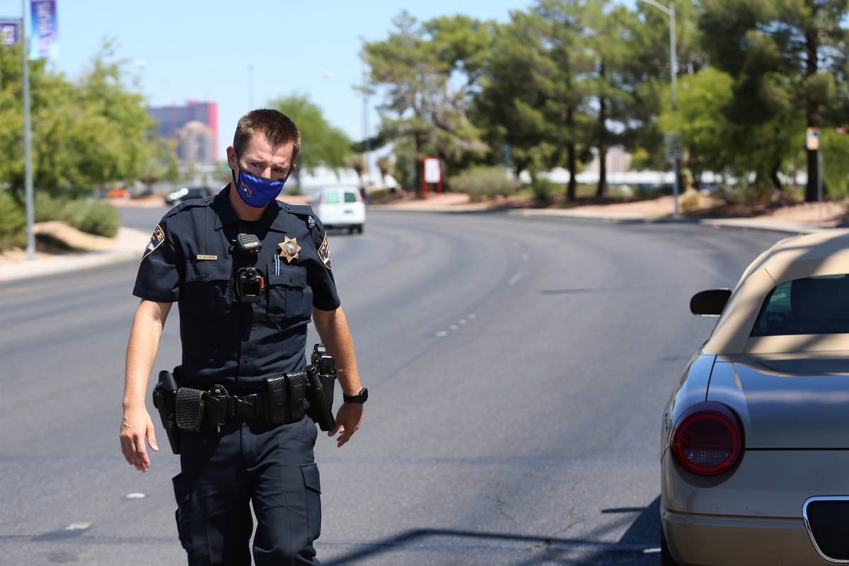 University Police Department officer Ryan Willman conducts a traffic stop on University Center ...