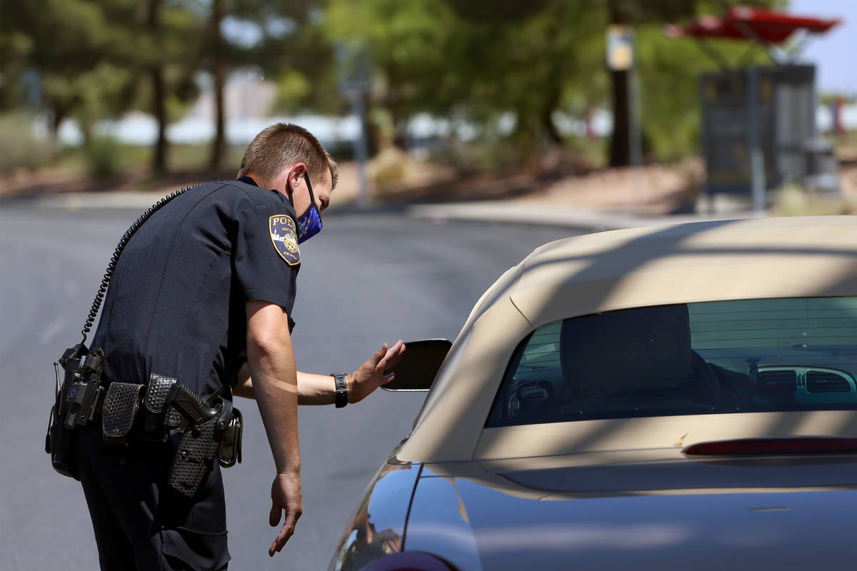 University Police Department officer Ryan Willman conducts a traffic stop on University Center ...