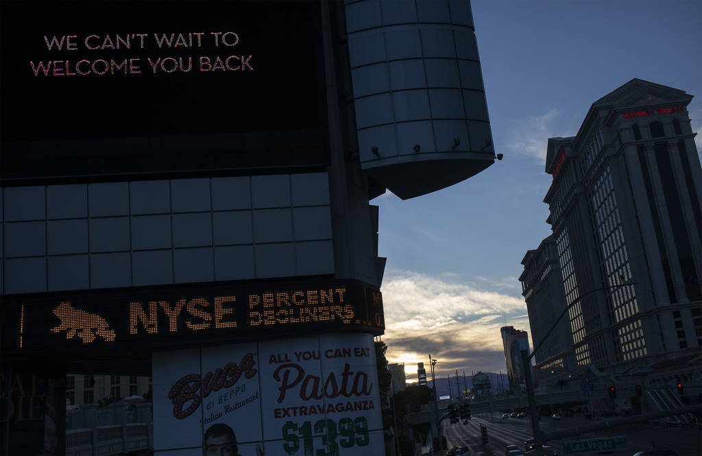 The Bally's marquee shows a message from MGM and stock market information on Tuesday, March 24, ...