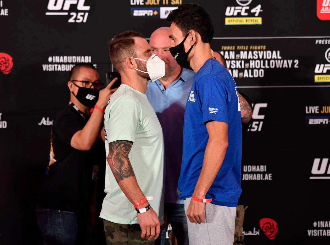 ABU DHABI, UNITED ARAB EMIRATES - JULY 10: (L-R) Opponents Alexander Volkanovski of Australia a ...