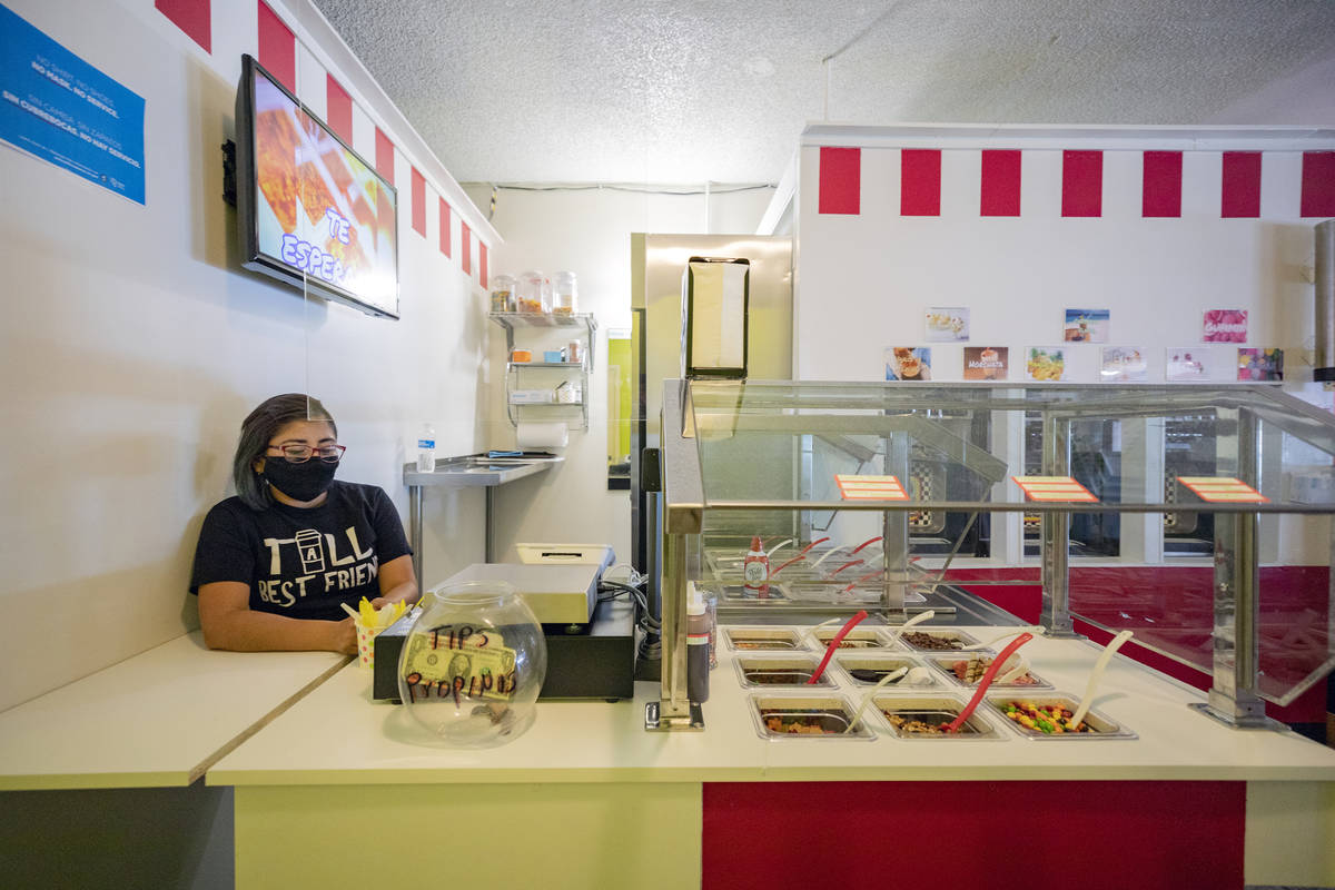 Alma Perez waits for customers at the frozen yogurt stand inside of El Menudazo, in North Las V ...