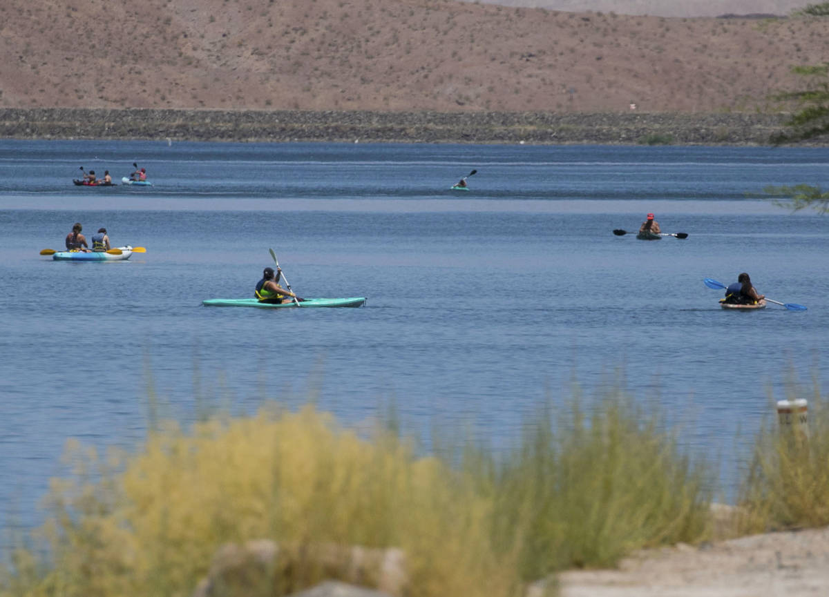 People enjoy paddle boarding at Lake Las Vegas on Monday, July 6, 2020, in Henderson. A dangero ...