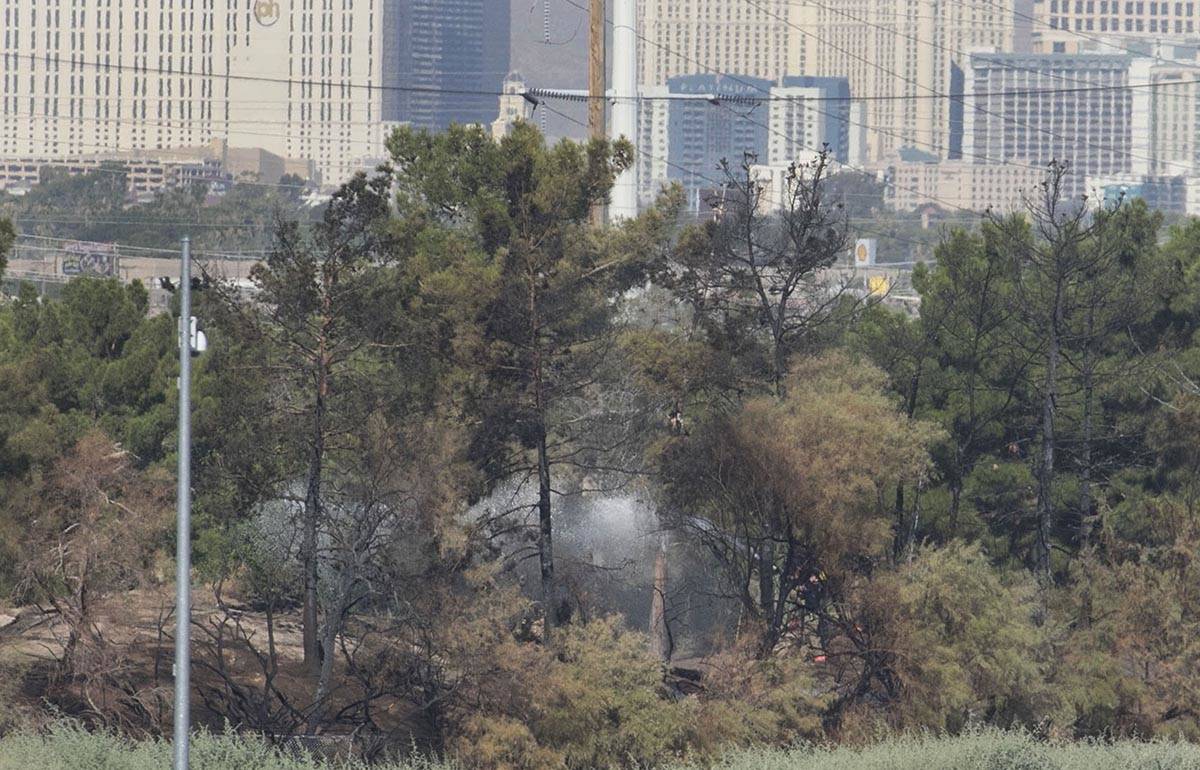 Clark County firefighters were called to a brush fire in east Las Vegas near Royal Links Golf C ...