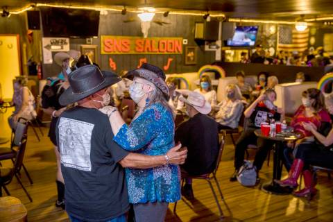 Teddy, left, and Brenda Valdez with Lone Wolf Dancing take to the floor as owner Bobby Kingston ...
