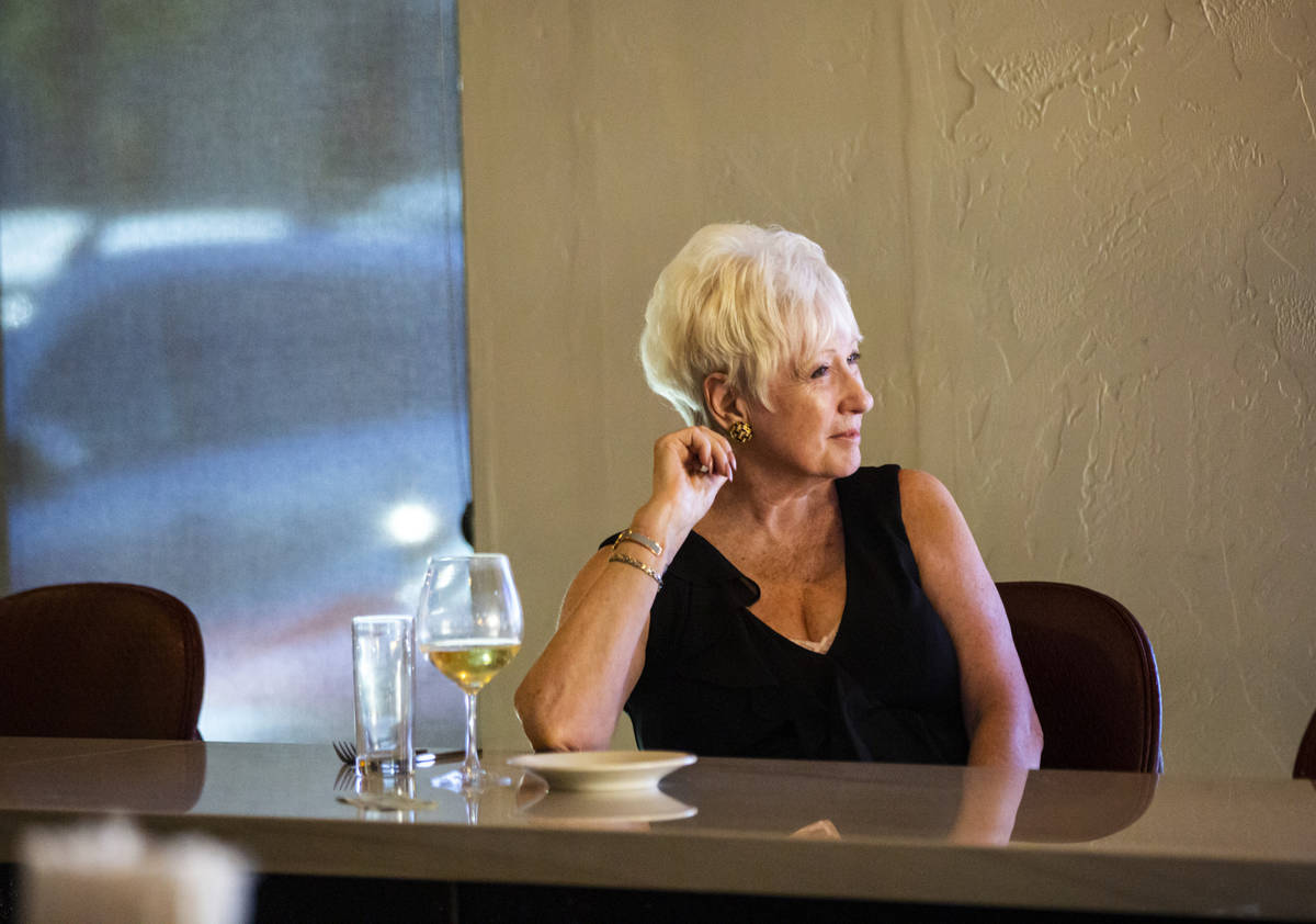 Dale Robins, of Las Vegas, sits with a glass of wine during happy hour at Spaghetty Western in ...