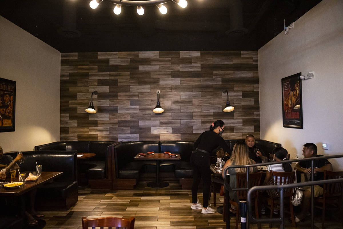 Bartender Scarlett Brock checks on diners at Spaghetty Western in the Southern Highlands area o ...