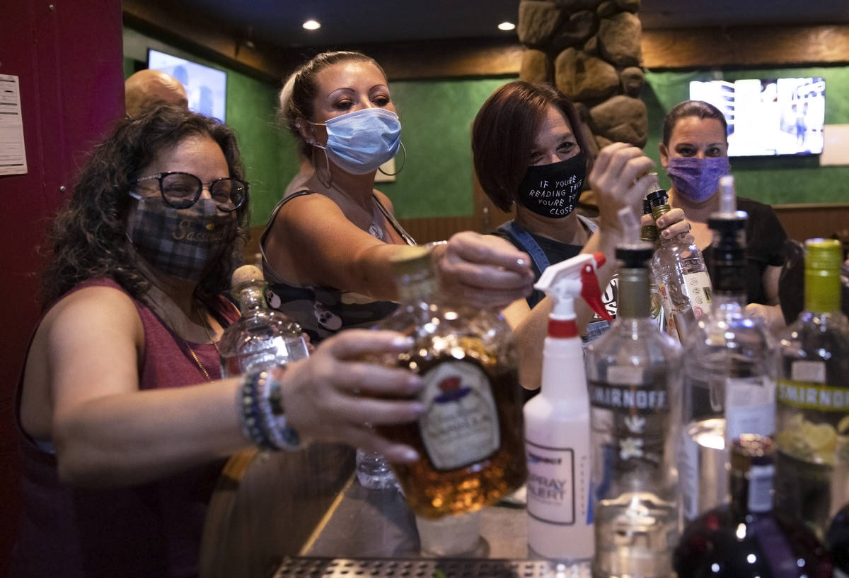 Owner Robin Slipock, left, Angel Stern and Jamie Stewart-Poyser break down the bar after last c ...