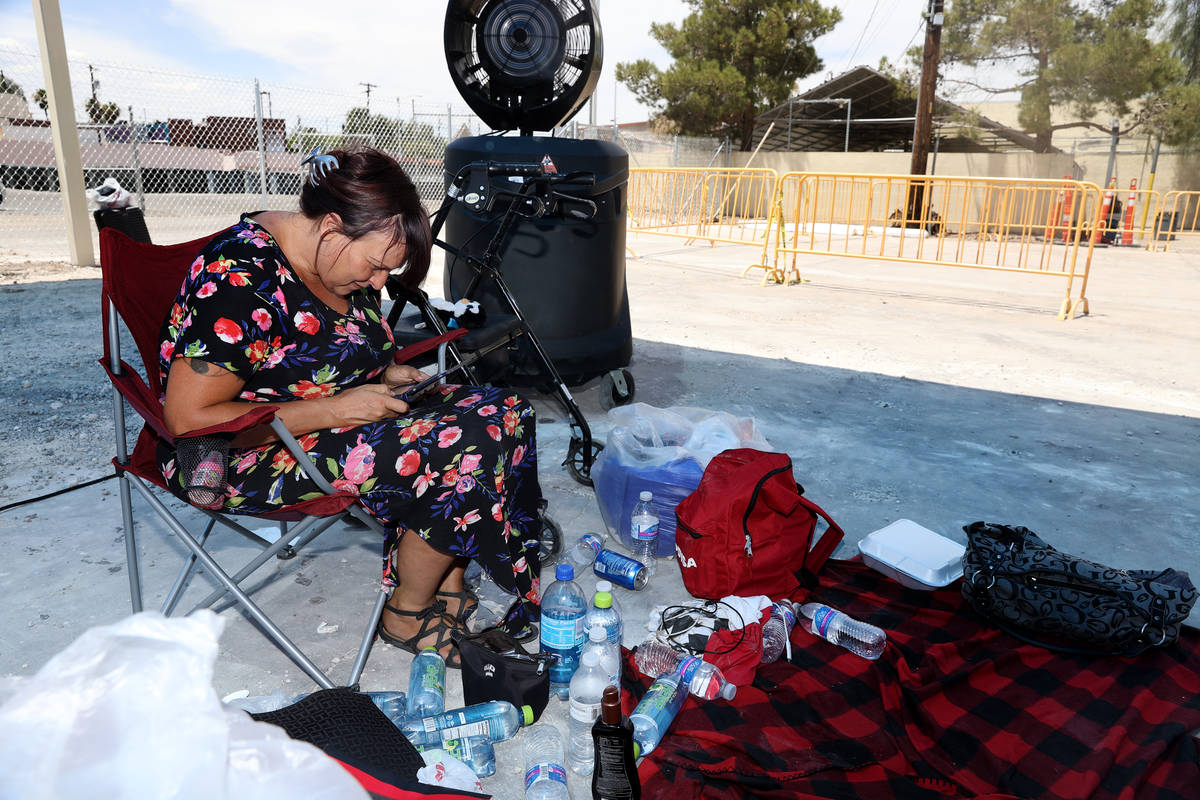 Elizabeth Lazio plays a Nintendo game at the Courtyard Homeless Resource Center cooling station ...