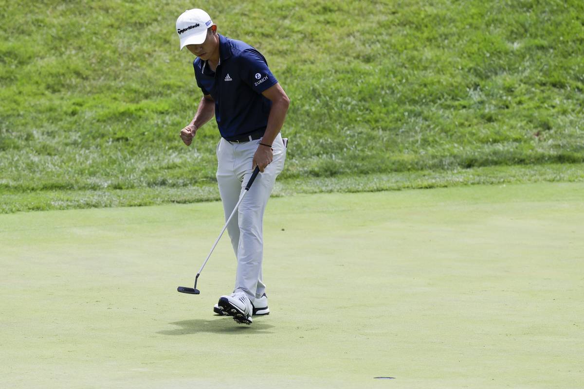 Collin Morikawa reacts to a putt on the 17th hole during the final round of the Workday Charity ...