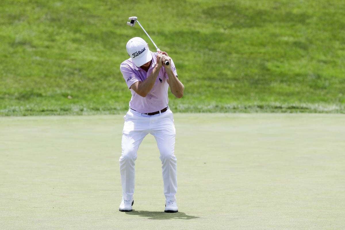 Justin Thomas reacts after missing a putt on the 18th hole during the final round of the Workda ...