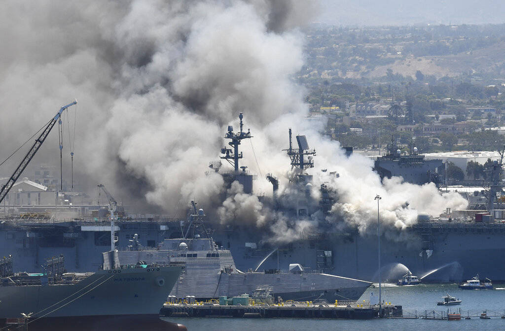 Smoke rises from the USS Bonhomme Richard at Naval Base San Diego Sunday, July 12, 2020, in San ...
