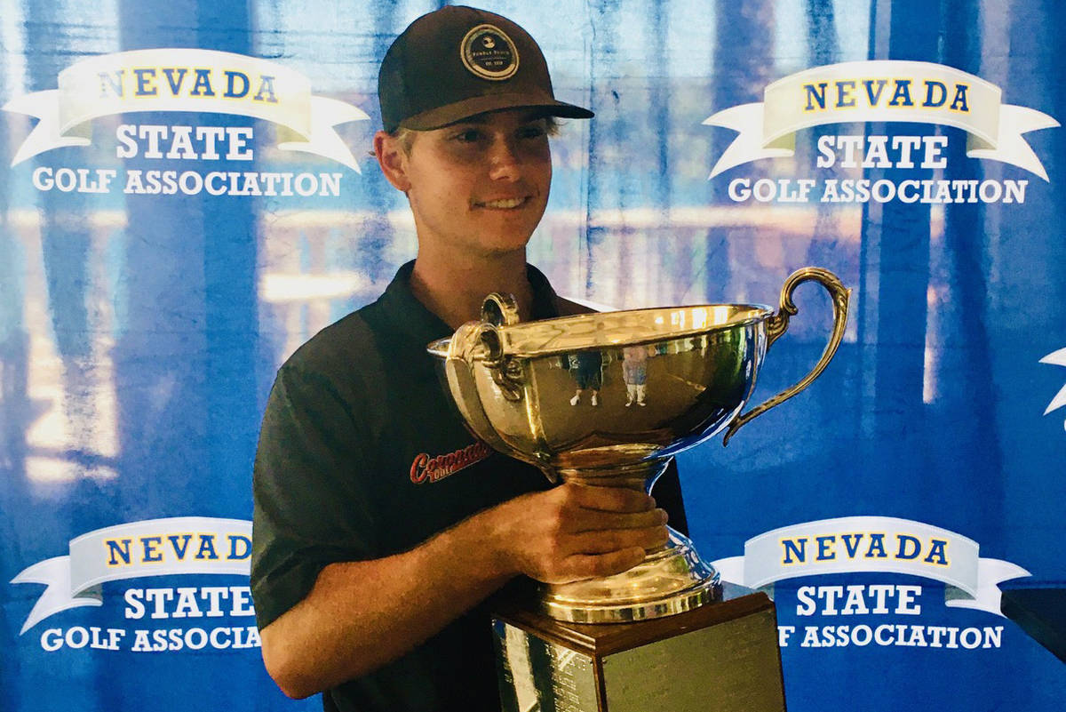 Michael Sarro celebrates with the trophy after winning the Nevada State Amateur Championship on ...