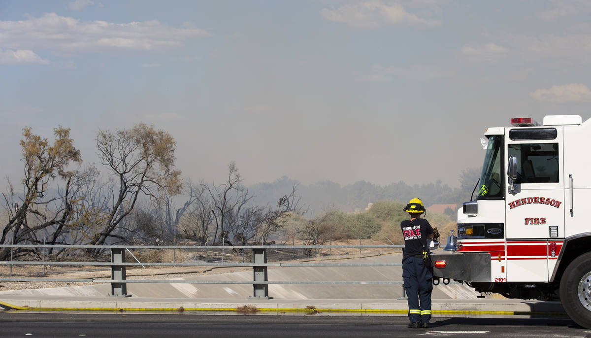 Clark County and Henderson Fire Departments respond to an outside fire on South Pecos Road next ...