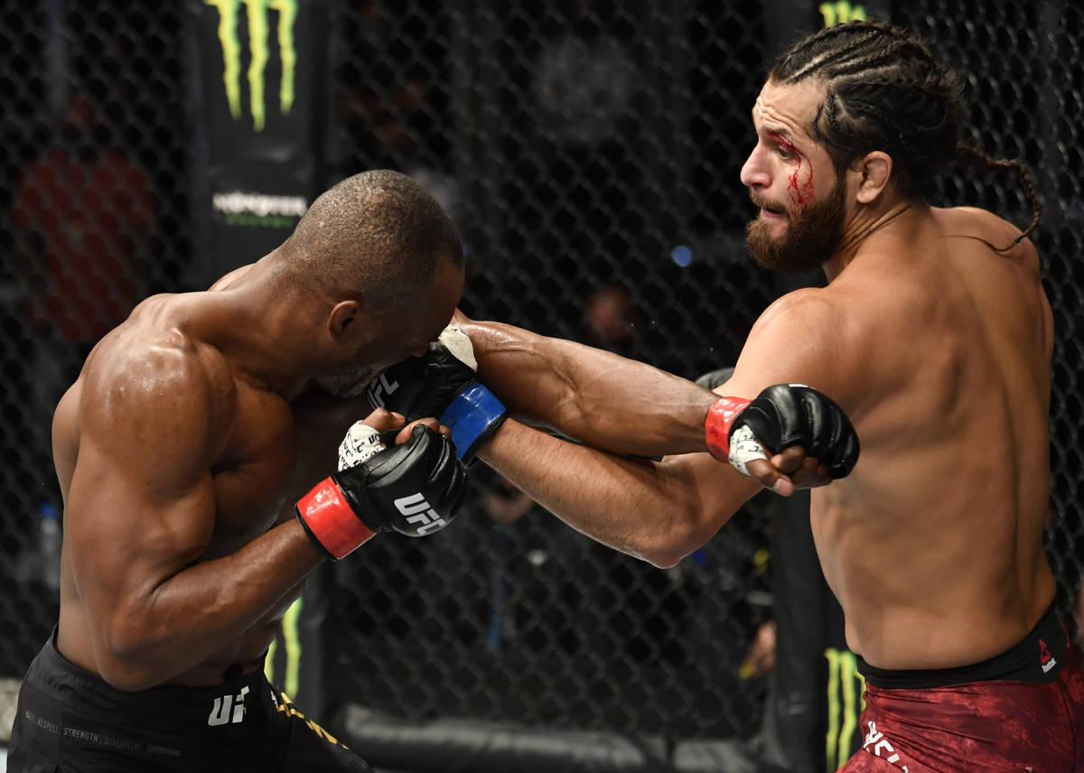(R-L) Jorge Masvidal punches Kamaru Usman of Nigeria in their UFC welterweight championship fig ...