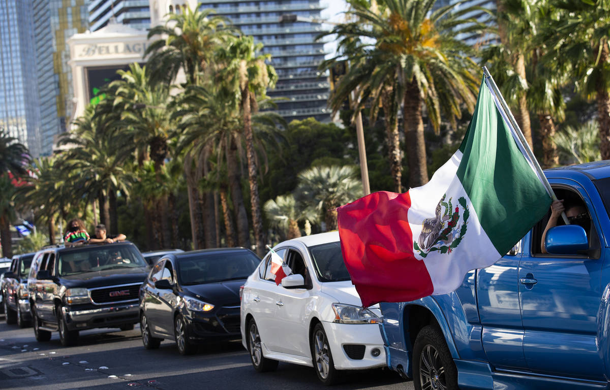 A caravan drives alongside a protest for Vanessa Guillen moves down Las Vegas Boulevard on Sund ...
