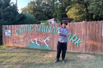 Zak Bagans is shown at the sign at the entrance Greater Wynnewood Exotic Animal Park on Saturda ...