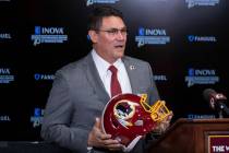 In a Jan. 2, 2020, file photo, Washington Redskins head coach Ron Rivera holds up a helmet duri ...