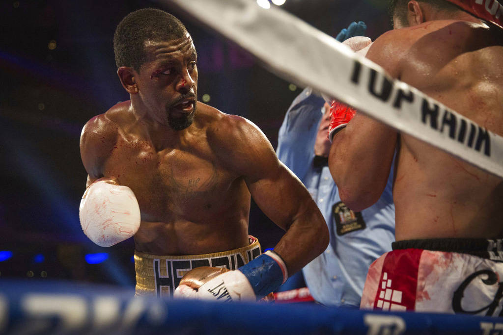 Jamel Herring keeps Juan Pablo Sanchez on the ropes during their lightweight boxing bout Saturd ...