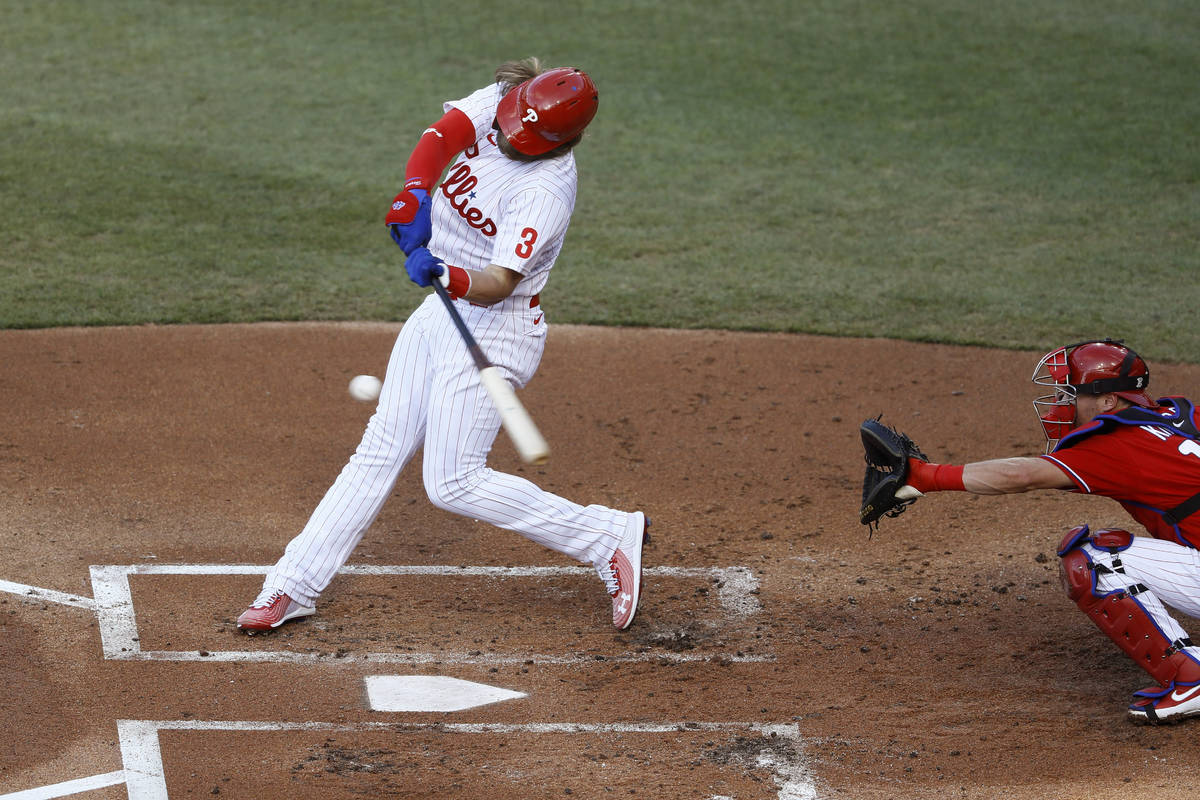 Philadelphia Phillies' Bryce Harper bats as Andrew Knapp catches during an intrasquad baseball ...
