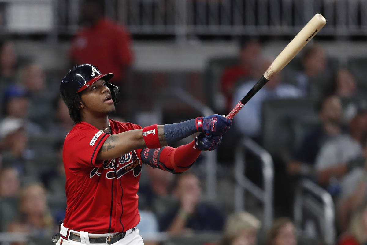 In this Sept. 20, 2019, file photo, Atlanta Braves' Ronald Acuna Jr. (13) follows through on a ...