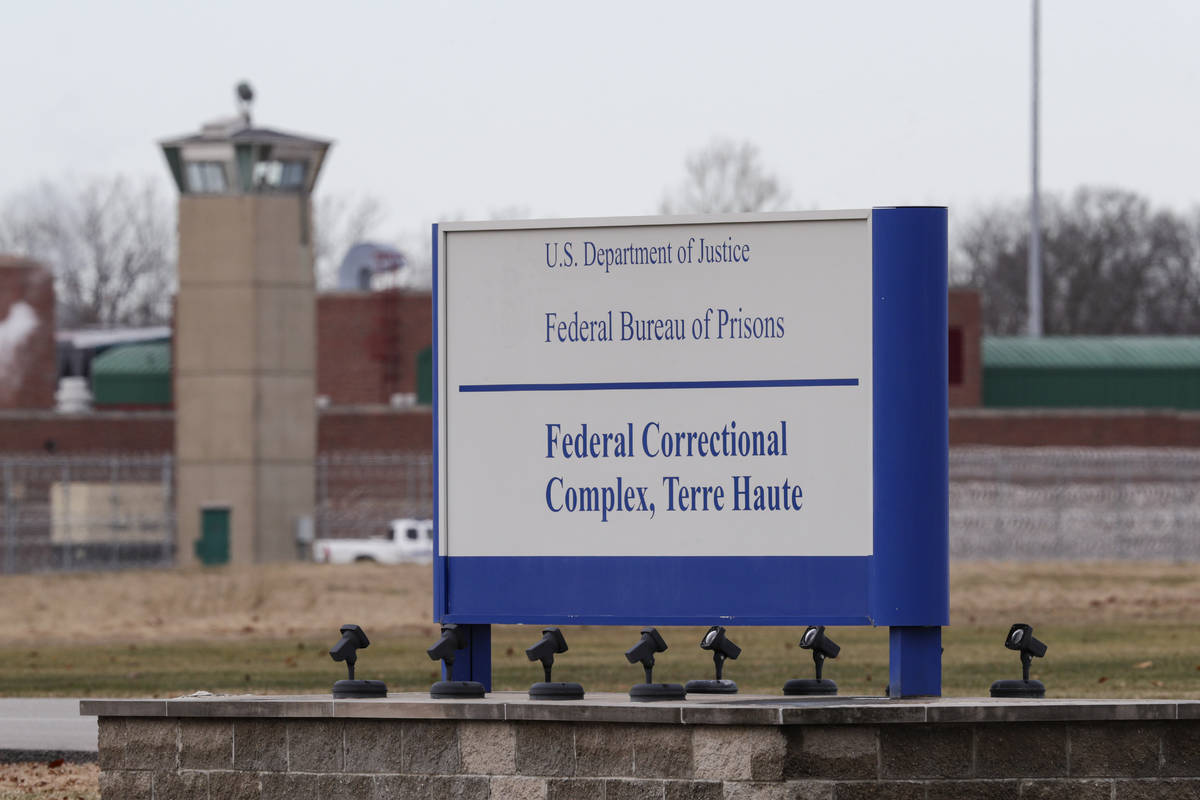 FILE - In this Dec. 10, 2019, file photo the guard tower flanks the sign at the entrance to the ...