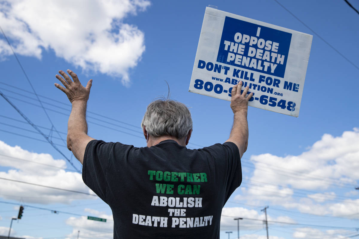 Protesters against the death penalty gather in Terre Haute, Ind., Monday, July 13, 2020. Daniel ...